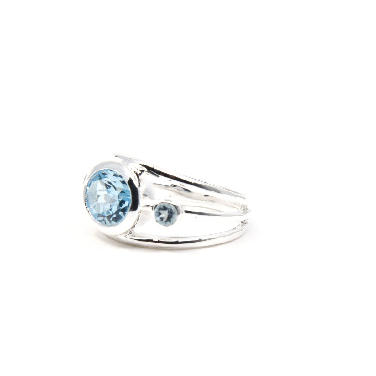 elegant side profile of Topaz (Blue) ring #R554, the gemstone catching light — Eternal Spirit