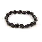 polished Garnet tumbled round bead bracelet on white background — Eternal Spirit