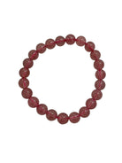 Strawberry Quartz bracelet resting on its crystal properties card — Eternal Spirit