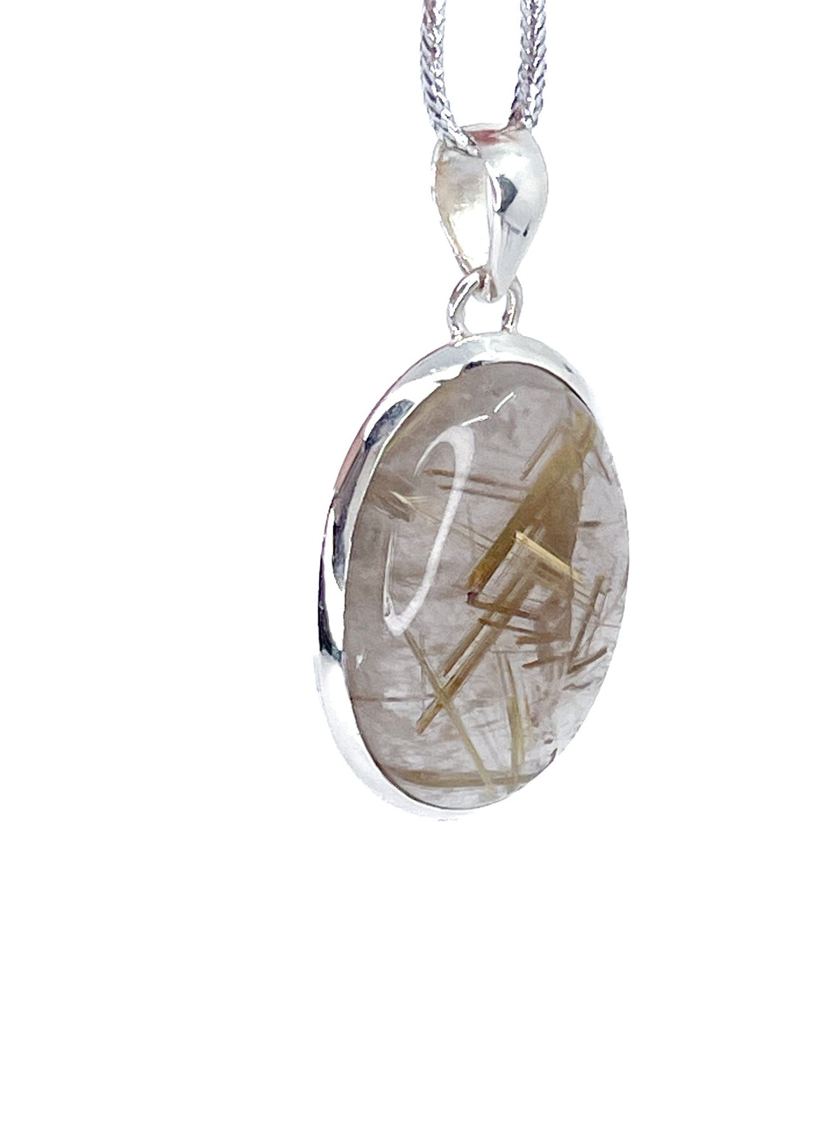 quartz (rutilated) cabochon oval pendant, angled view showing silver bail and stone profile — Eternal Spirit