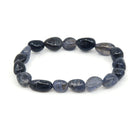 polished Iolite tumbled round bead bracelet on white background — Eternal Spirit