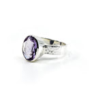 Amethyst ring #R740 angled to reveal its polished setting and silver band — Eternal Spirit