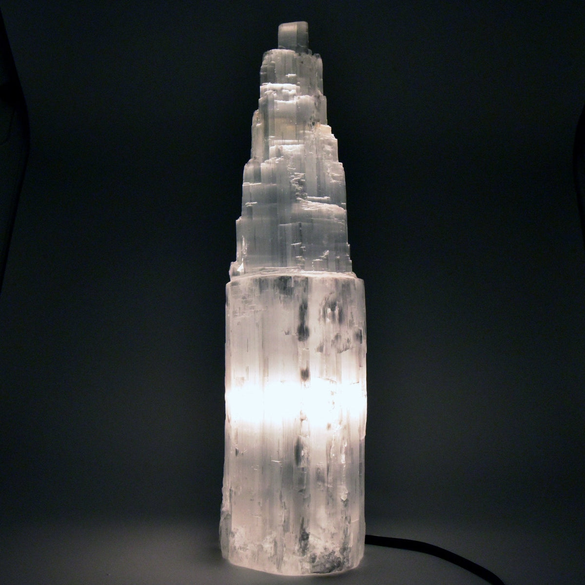 luminous white Selenite crystal lamp (L), glowing from within — Eternal Spirit