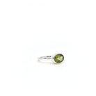 Peridot ring #R338 angled to reveal its polished setting and silver band — Eternal Spirit