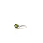 elegant side profile of Peridot ring #R338, the gemstone catching light — Eternal Spirit