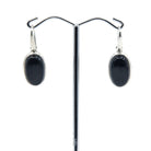tourmaline (black) cabochon oval earrings with silver setting on white background — Eternal Spirit