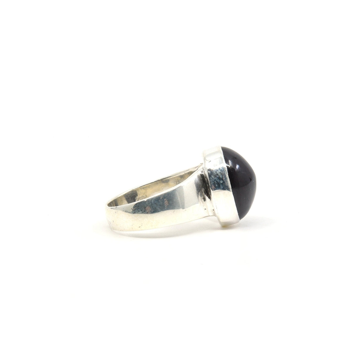 Ruby (Star) ring #R287 angled to reveal its polished setting and silver band — Eternal Spirit