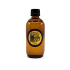 Sacred Elements massage oil 200ml, lifestyle display with botanicals — Eternal Spirit