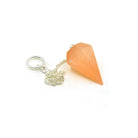 Close-up of Selenite (Peach) large faceted pendulum, warm peach stone detail — Eternal Spirit