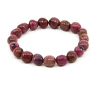 polished Rhodonite tumbled round bead bracelet on white background — Eternal Spirit