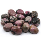 collection of polished Rhodonite tumble stones — Eternal Spirit