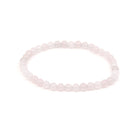 polished Quartz (Rose) 4mm round bead bracelet on white background — Eternal Spirit