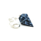 Close-up of Sodalite large faceted pendulum, deep blue stone detail — Eternal Spirit