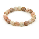 polished Sunstone tumbled round bead bracelet on white background — Eternal Spirit