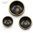 gazing down into the 14.5cm Black & Gold Om Mani Third Eye chakra singing bowl — Eternal Spirit