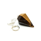 Close-up of Tiger Eye (Yellow) large faceted pendulum, golden-banded stone detail — Eternal Spirit