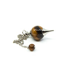 Close-up of Tiger Eye (Yellow) sphere pendulum, golden-banded stone detail — Eternal Spirit