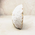 Agate crystal geode 11.5cm, pale speckled outer rind, side view — Eternal Spirit