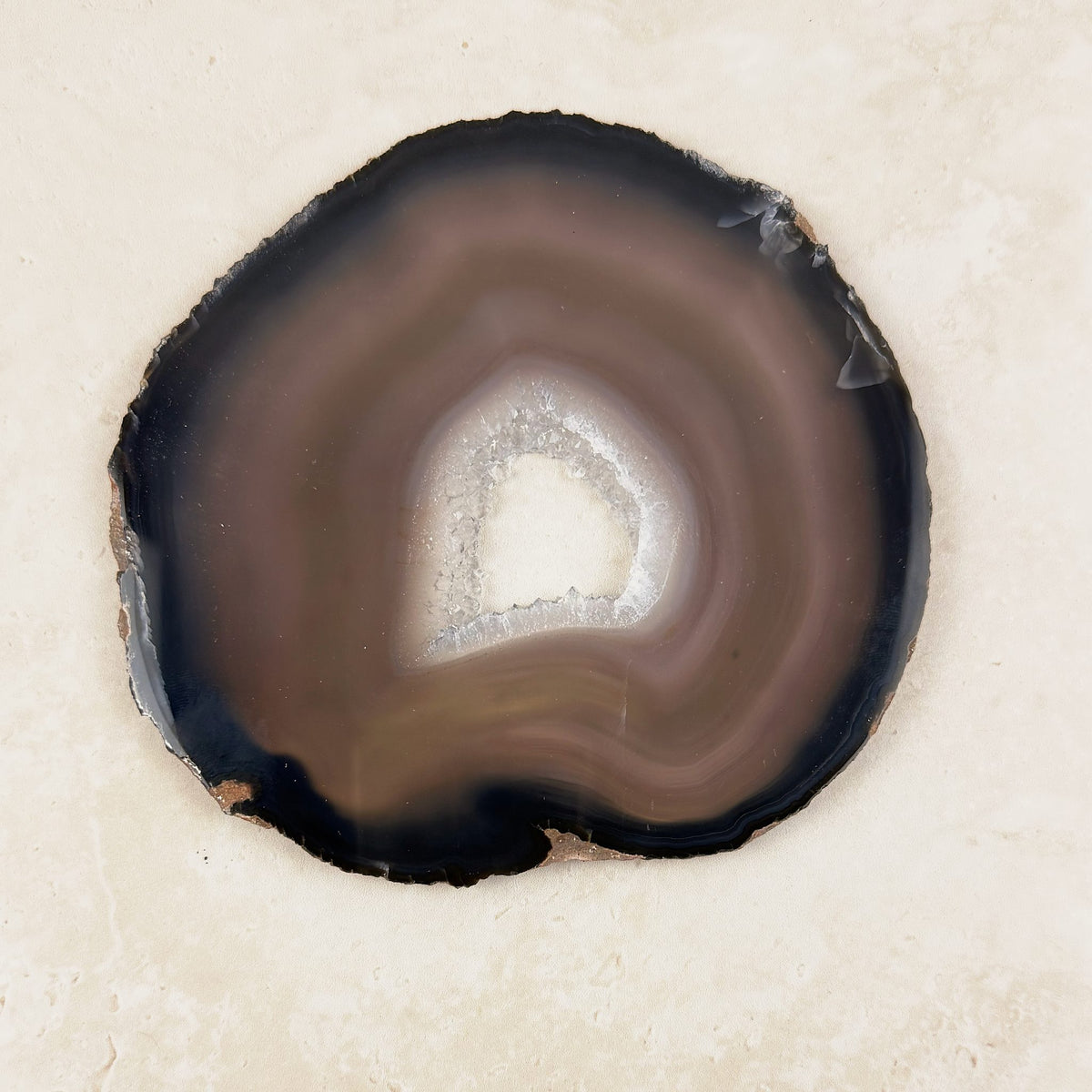 Agate crystal slice 14.5cm, natural brown and black bands around a white centre, from above — Eternal Spirit