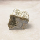 Blue lace agate rough crystal 5cm, pale blue-grey bands under a cream crust, front view — Eternal Spirit