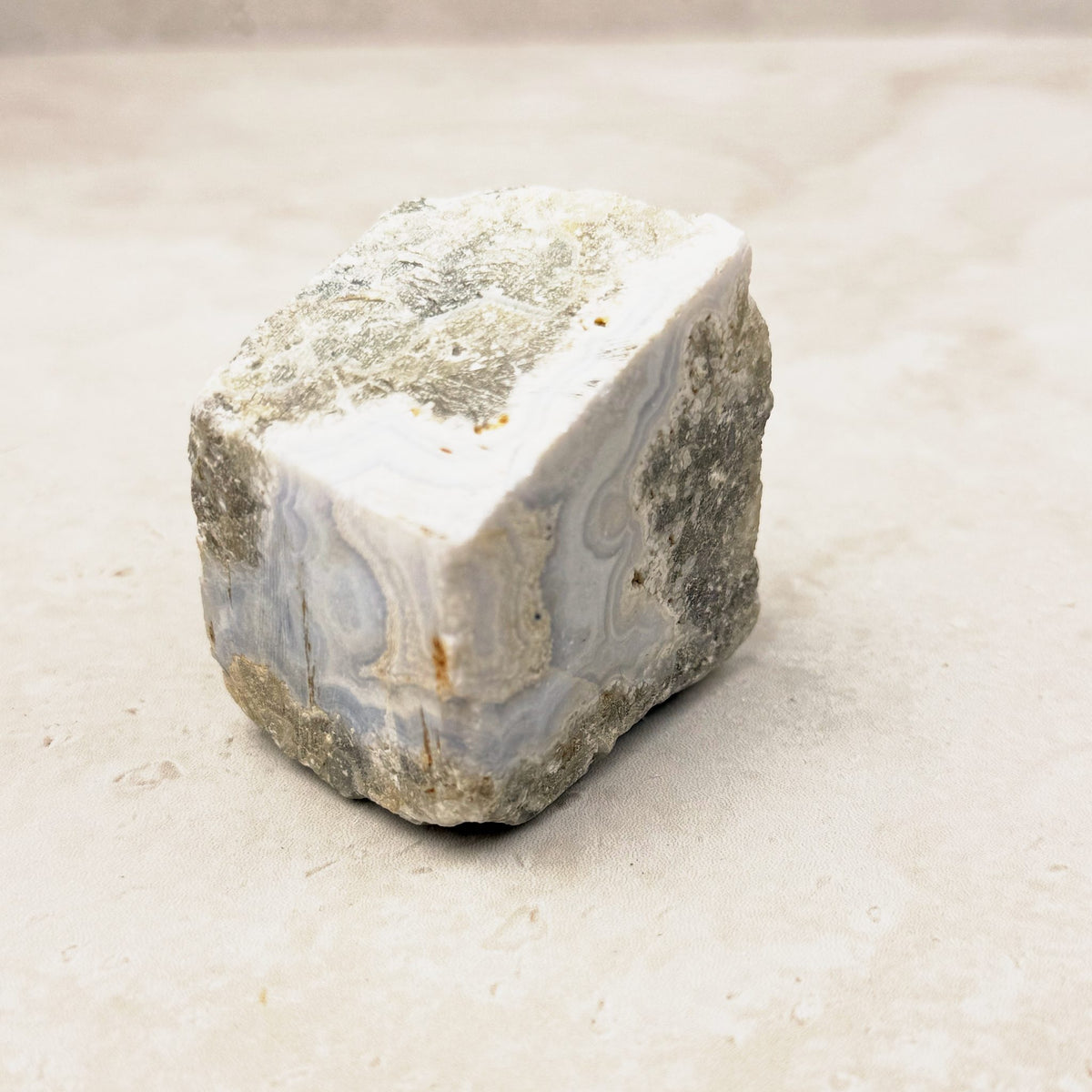 Blue lace agate rough crystal 5cm, soft blue banding on a chunky rough piece, angled view — Eternal Spirit