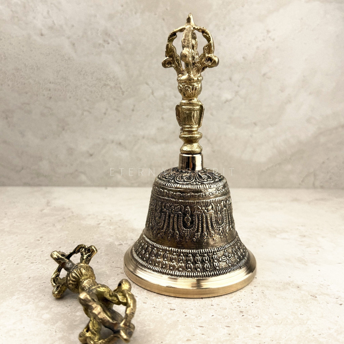 Brass Tibetan bell 18cm with its dorje beside it, ornate front view — Eternal Spirit