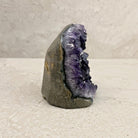 Base cut amethyst crystal 11cm, white crystal rim, side view — Eternal Spirit