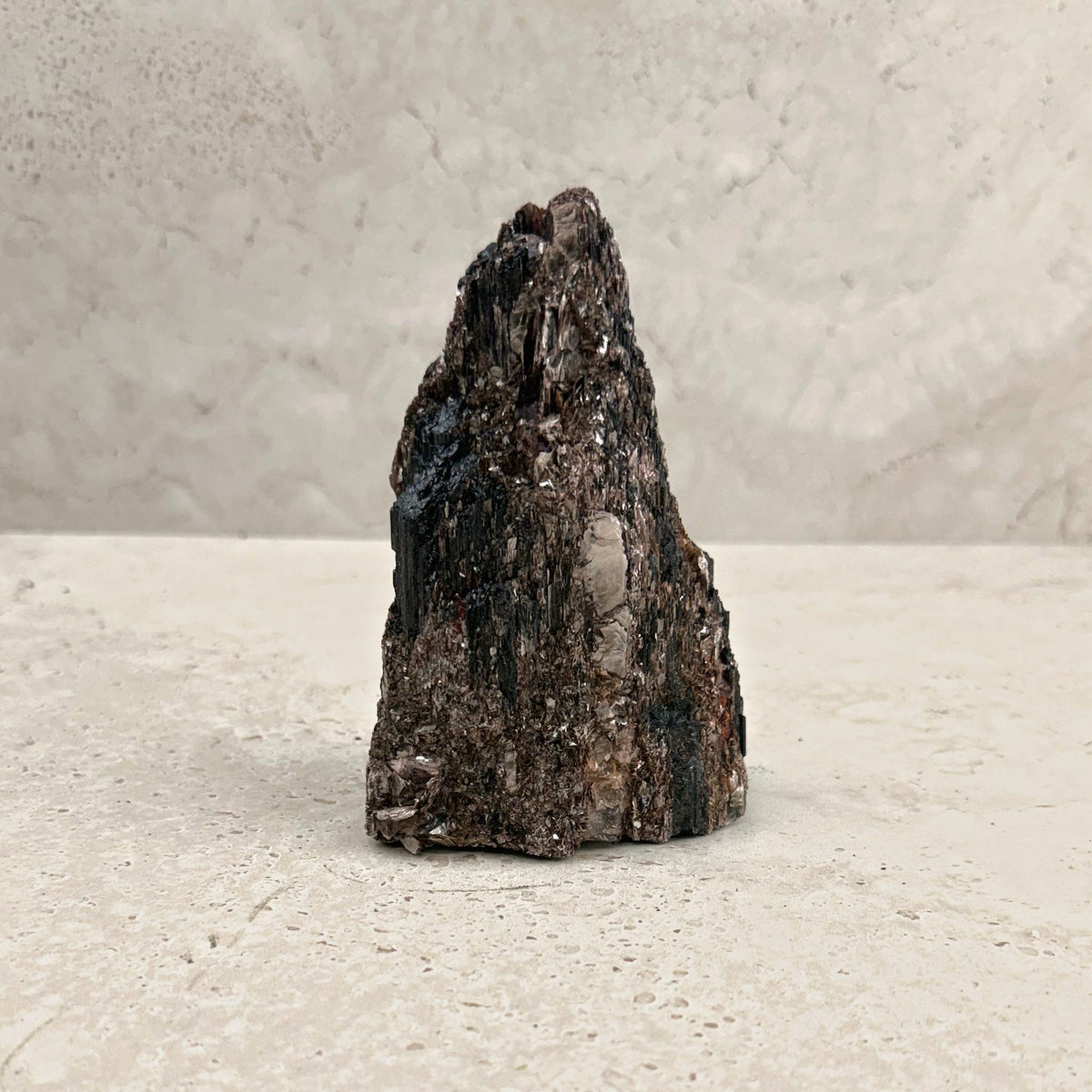 Rough black tourmaline crystal 12cm, bronze shimmer across the ridges, front view — Eternal Spirit