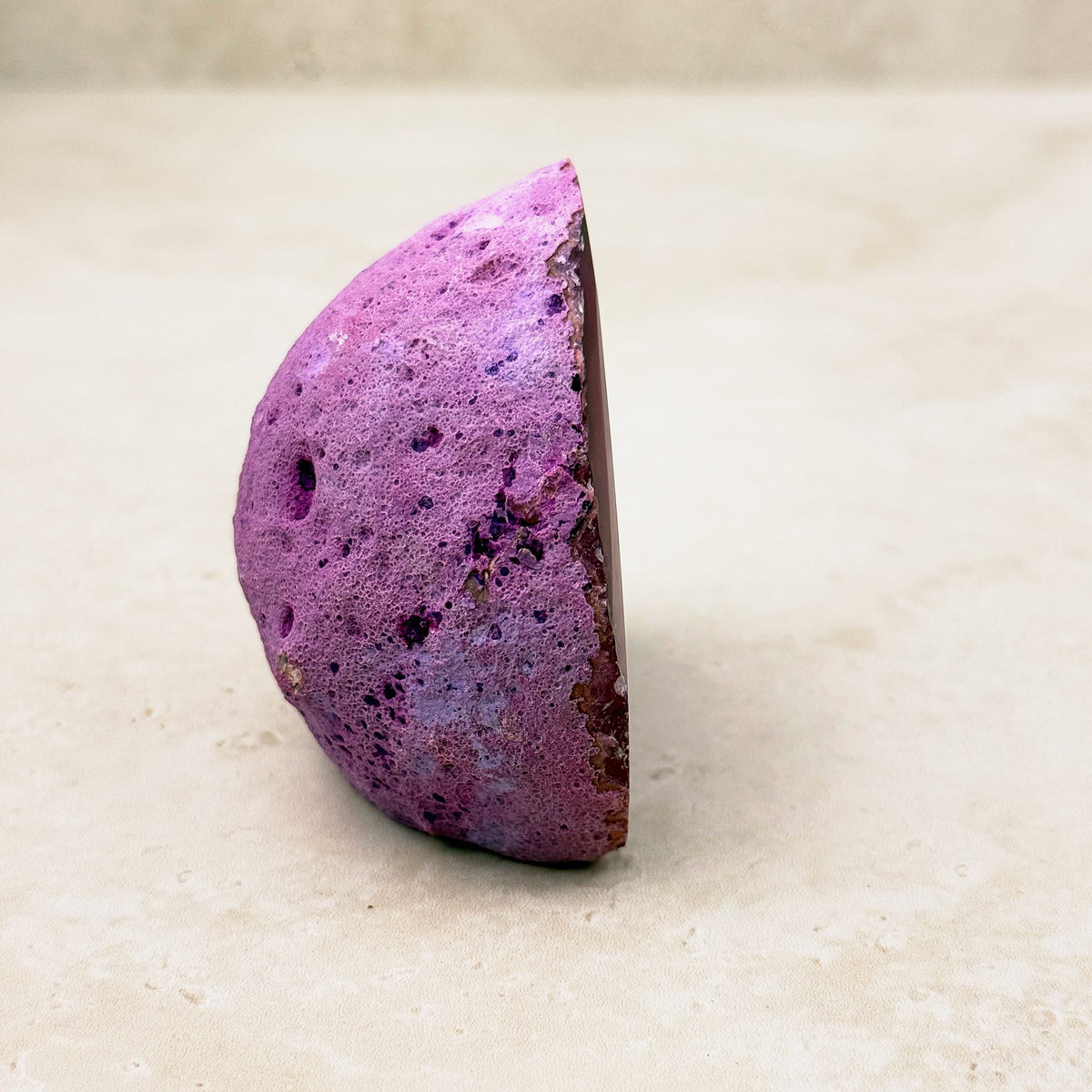 Dyed pink agate crystal geode 6.5cm, bright pink outer rind, side view — Eternal Spirit