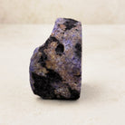 Dyed purple agate crystal geode 6.5cm, mottled purple and black outer rind, side view — Eternal Spirit