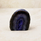 Dyed purple agate crystal geode 6cm, dark purple bands around a sparkling hollow, front view — Eternal Spirit
