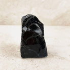 Flecked black obsidian rough 10cm, jet black standing piece, front view — Eternal Spirit