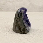Base cut amethyst crystal 7.5cm, pale crystal band on the grey shell, side view — Eternal Spirit