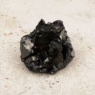 Glossy elite shungite rough crystal 5cm, sharp angles and a bright black shine, front view — Eternal Spirit
