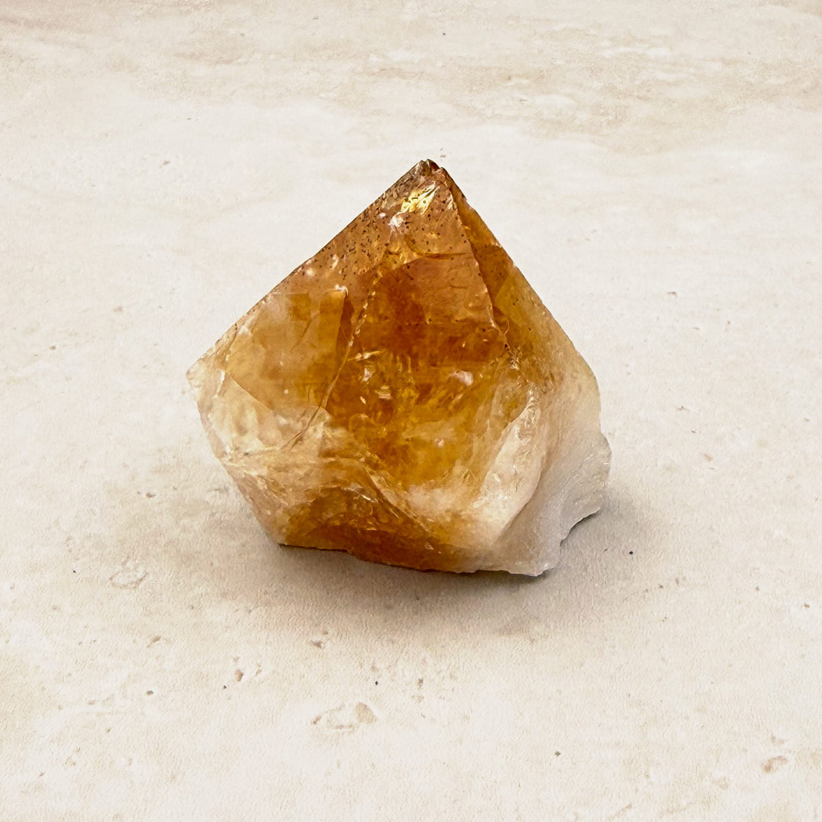 Heated citrine base cut crystal 5cm, amber point rising from a white base, front view — Eternal Spirit