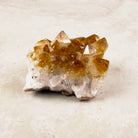 Heated citrine crystal cluster 8.5cm, golden points rising from a pale quartz base, low side view — Eternal Spirit