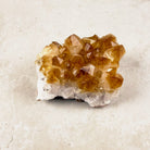 Heated citrine crystal cluster 8.5cm, amber points over a white quartz base, from above at an angle — Eternal Spirit