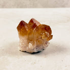 Heated citrine crystal cluster 5.5cm, tall amber points on a pale base, front view — Eternal Spirit