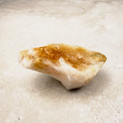 Heated citrine crystal point 9cm, amber tip and a white quartz body, lying on its side — Eternal Spirit