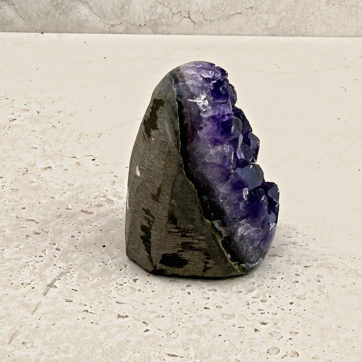 Base cut amethyst crystal 7cm, grey stone shell, side view — Eternal Spirit