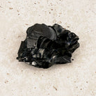 Layered elite shungite rough crystal 6cm, glossy stepped black layers, viewed from above — Eternal Spirit