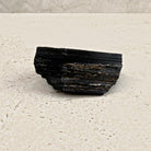 Rough black tourmaline crystal 8.5cm, long rectangular log, angled view — Eternal Spirit