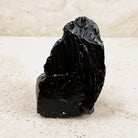 Ridged black obsidian rough 10cm, feathery ridges on a glossy face, standing upright — Eternal Spirit