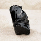 Ridged black obsidian rough 10cm, deep glossy volcanic glass, side view — Eternal Spirit