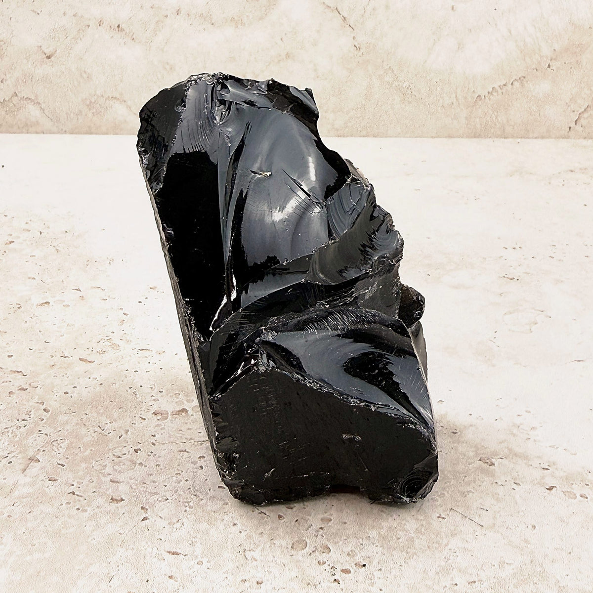 Ridged black obsidian rough 10cm, deep glossy volcanic glass, side view — Eternal Spirit