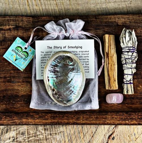 self love smudging kit, aromatic smoke curling from a lit bundle — Eternal Spirit