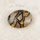 Septarian crystal soap stone 7cm, grey with a honey and brown cracked pattern, viewed from above — Eternal Spirit