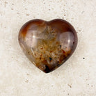 Speckled carnelian crystal heart 6cm, smoky amber edges and a creamy speckled centre, from above — Eternal Spirit