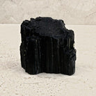 Rough black tourmaline crystal 8cm, chunky stepped block, front view — Eternal Spirit