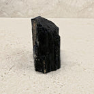 Rough black tourmaline crystal 8cm, chunky stepped block, side view — Eternal Spirit